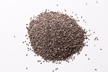 Chia seeds on a white isolated background close-up.