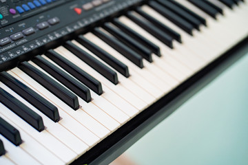 black and white piano keys synth. close-up. 