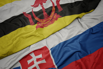 waving colorful flag of slovakia and national flag of brunei.