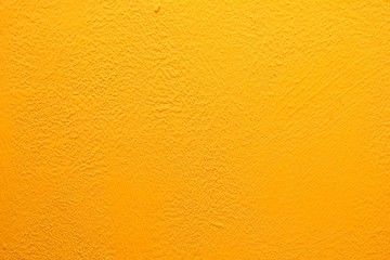 Yellow wall texture. Bright warm yellow wall background