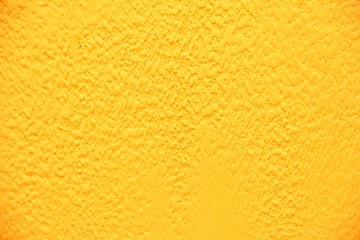 Yellow wall texture. Bright warm yellow wall background