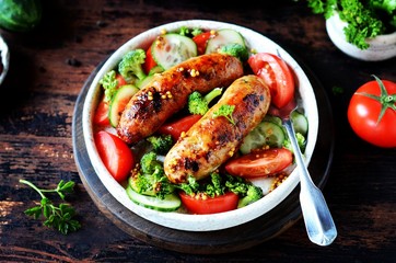 Homemade chicken (turkey) fried sausages with broccoli, tomato and cucumber salad 