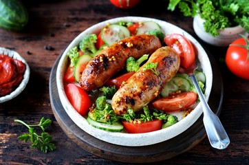 Homemade chicken (turkey) fried sausages with broccoli, tomato and cucumber salad 