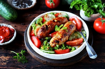 Homemade chicken (turkey) fried sausages with broccoli, tomato and cucumber salad 