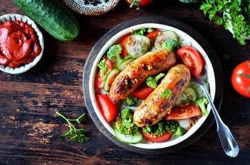 Homemade chicken (turkey) fried sausages with broccoli, tomato and cucumber salad 