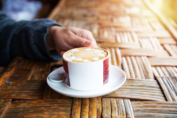 Drinking coffee in worm tone.