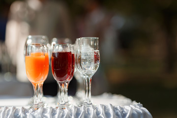 Red and yellow juice in tall glasses