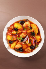 potato, veal, tomato sauce and olive