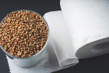 buckwheat and toilet paper, selective focus, the concept of self- isolation from infection and food supply
