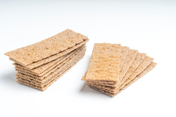 rye crackers on a white background close-up, selective focus