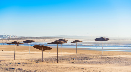 View of the sandy empty beach, Essaouira, Morocco. Copy space for text.