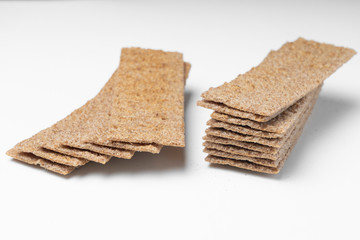 rye crackers on a white background close-up, selective focus