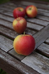 Red apples in a wooden rustic setting