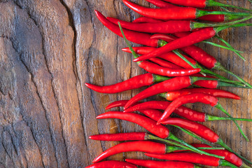  fresh Red chilli on a wooden background