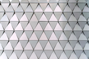 Building structures of aluminum triangle geometry on facade of modern urban architecture