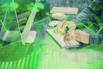 Double exposure of financial graph with man works in office on background. Concept of analysis.