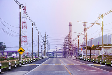 Industrial factory plant with flare light from sunset