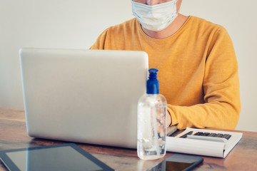 A person working at home on laptop during epidemic