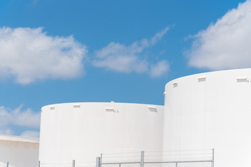 Close-up white oil storage tank in cloud blue sky in Corpus Christi, Texas, America