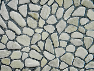 Grey stones and concrete wall surface textured background pattern