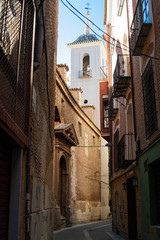 Lonely street with church in Spain