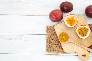 Close up a fresh passion fruit on white wooden table background