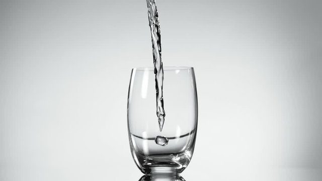 Super slow motion of pouring water into glass. Filmed on very high speed camera, 1000 fps.