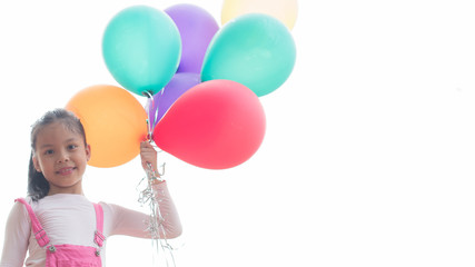 happy little asian girl child playing with colorful toy balloons outdoors. summer holidays, celebration, family, children and people-happy girl with colorful balloons. freedom and imagination concept.