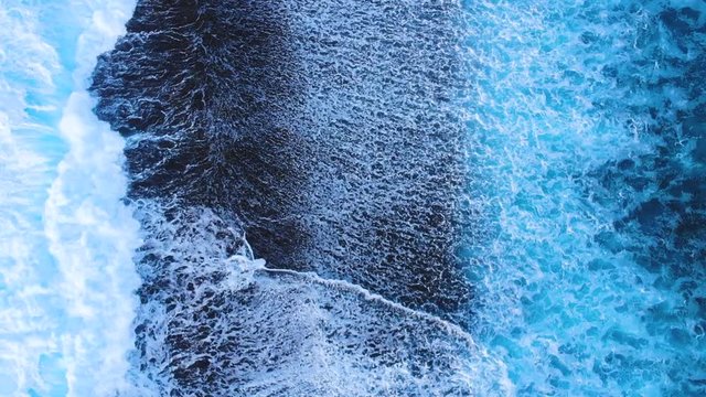 Waves breaking in the beautiful coral reef in Moorea in French Polynesia.