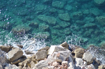 Fototapeta na wymiar The clear water of the Adriatic Sea. The rocky bottom is visible.