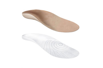 Isolated orthopedic insole on a white background. Treatment and prevention of flat feet and foot diseases. Foot care, comfort for the feet. Wear comfortable shoes. Medical insoles.