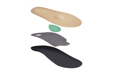Isolated orthopedic insole on a white background. Treatment and prevention of flat feet and foot diseases. Foot care, comfort for the feet. Wear comfortable shoes. Medical insoles.