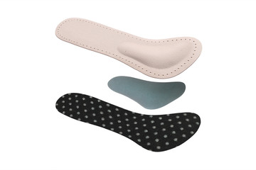 Isolated orthopedic insole on a white background. Treatment and prevention of flat feet and foot diseases. Foot care, comfort for the feet. Wear comfortable shoes. Medical insoles.