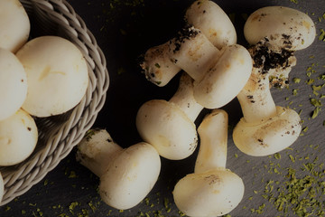Close up, group of champignon on slate table base