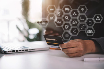 Male hold credit cards, conduct financial transactions via tablets and data documents, put on the...