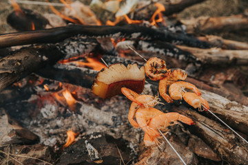 Preparing Shrimp at campfire.