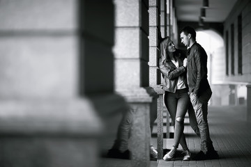 young family in the city on an autumn walk / lovers in jackets, walking in the autumn city