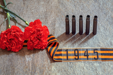 St. George ribbon in numbers 1945, two cloves and old cartridge cases. Template for greeting cards,...