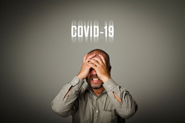Frustrated man and Covid-19. Coronavirus outbreak and Quarantine concept.