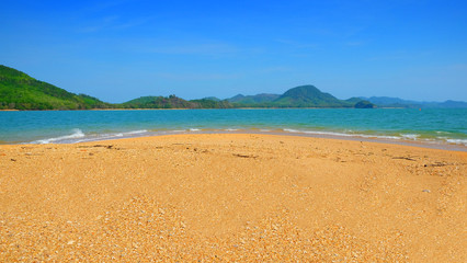 Peaceful sand beach with mountain and clear blue sky horizontal seascape., Thailand.