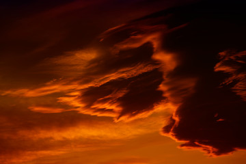 Dark red cloudy sky after sunset.