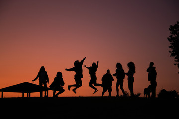 Fototapeta na wymiar silhouettes of people on a sunset