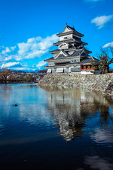 Fototapeta na wymiar Reflexion of the Matsumoto Castle in the Water Surface, Japan