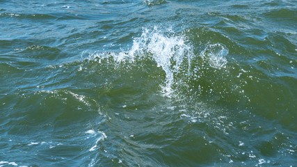 Shiny ripple on the surface of the sea water surface. Selective focus.