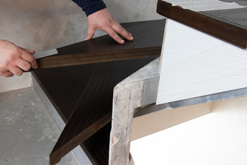  measurement of stairs. The master measures the steps close up, the metering tool is nearby