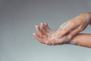 Fototapeta premium Woman washing and rubbing hands with soap for corona virus prevention; hygiene to stop spreading coronavirus.