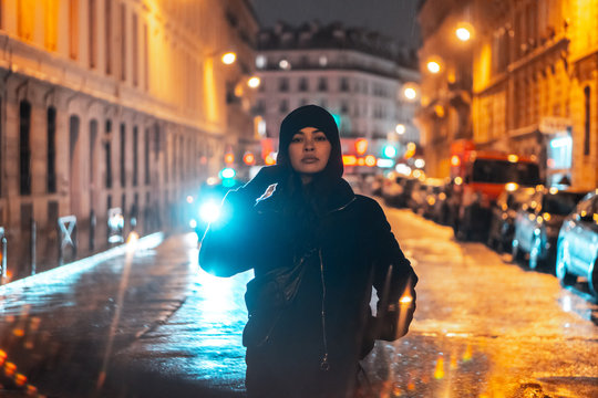 Youn women posing in street in the night