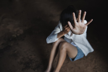 Woman's hand extended signaling to stop useful to campaign against violence, gender or sexual discrimination