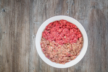 Minced meat from pork and beef in white bowl