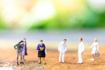 Miniature people: Check your health with doctor. Image use for drug, pills, capsules ,Health and medicine concept.